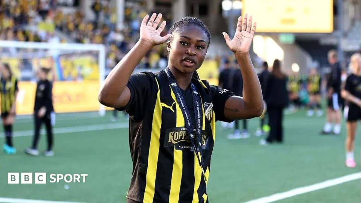 Player waving during post-match celebration on field