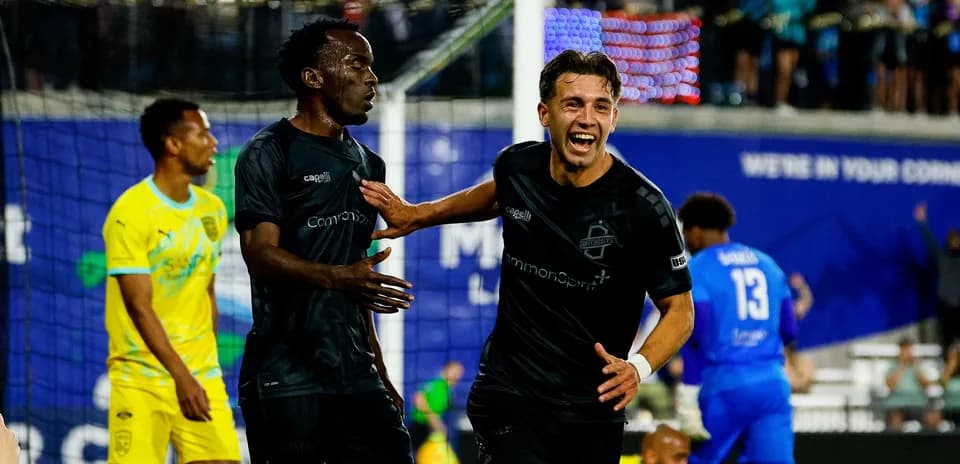 Players celebrating a goal during FC Tulsa match