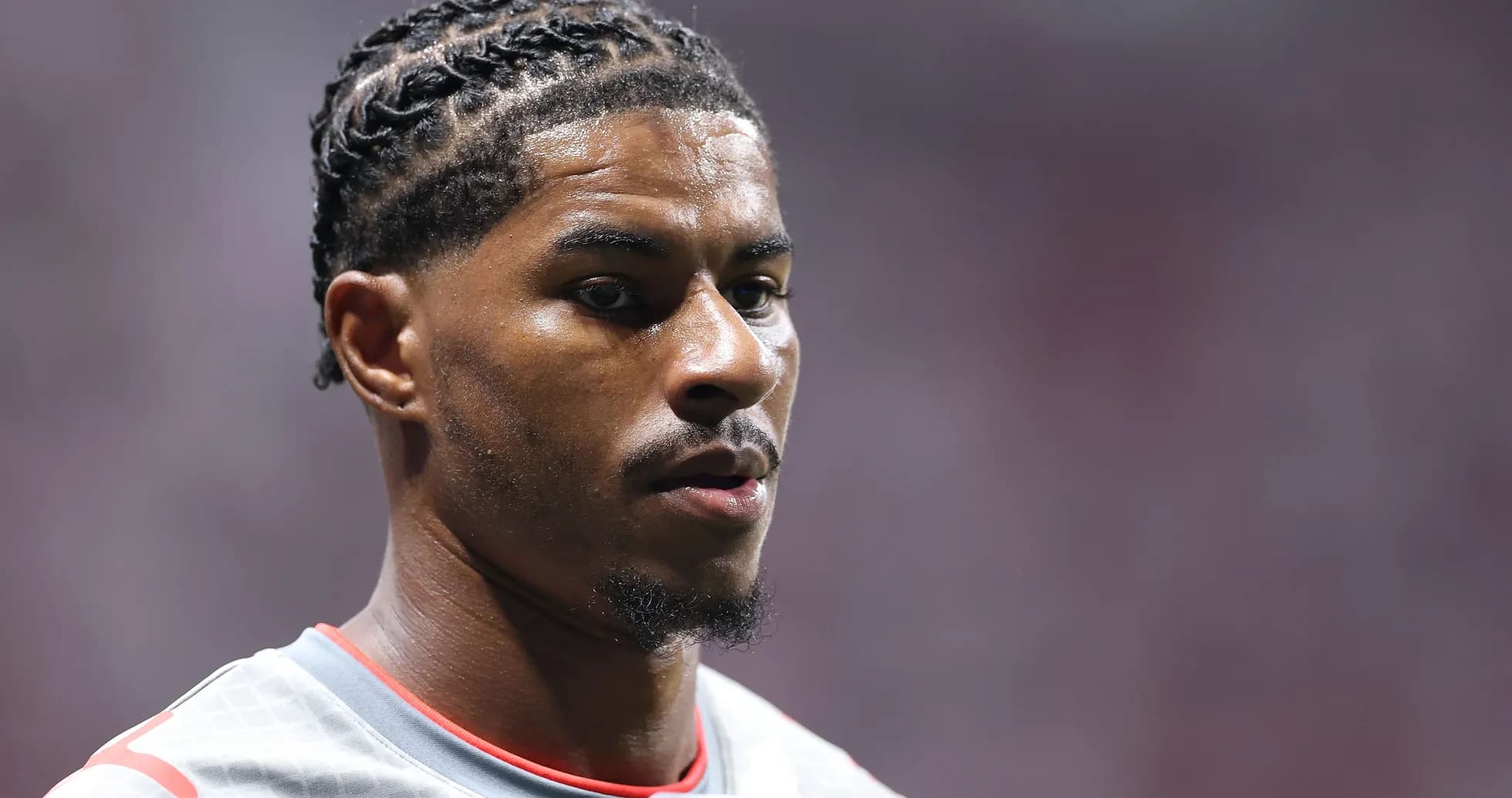 Player with braided hair in sports uniform