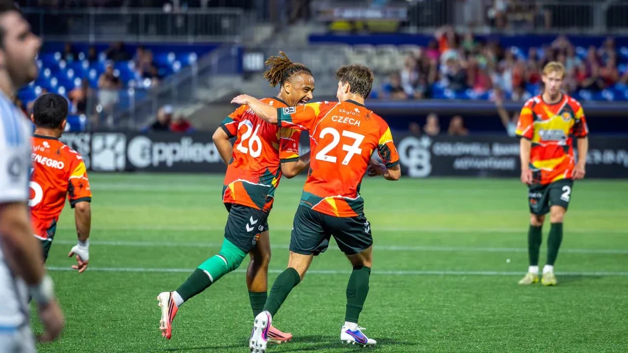 Players celebrating a goal during match