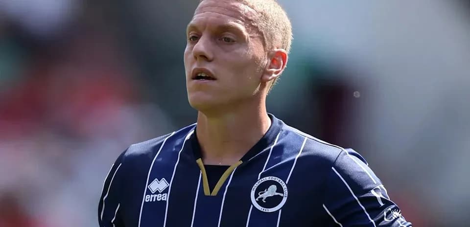 Football player in Millwall jersey during match