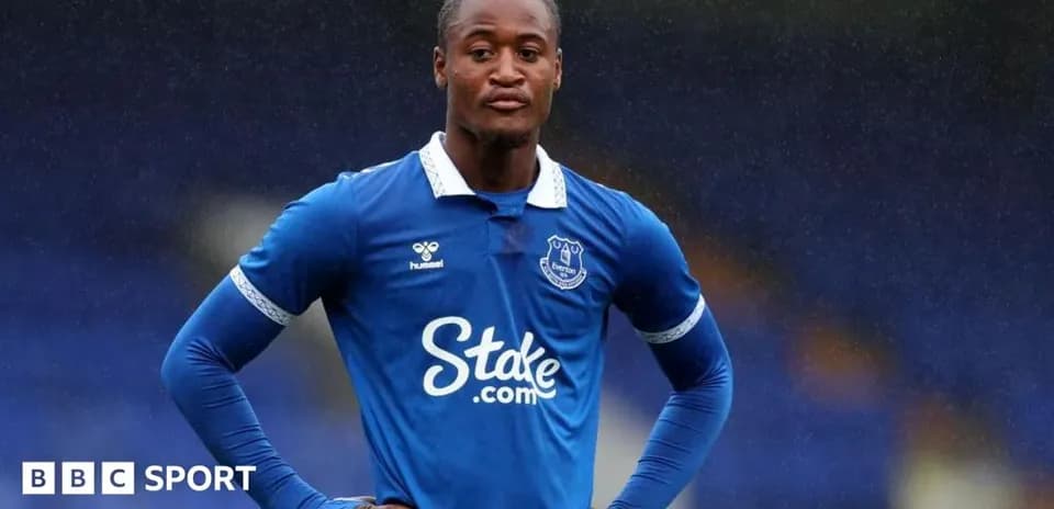 Everton player standing on the pitch during match