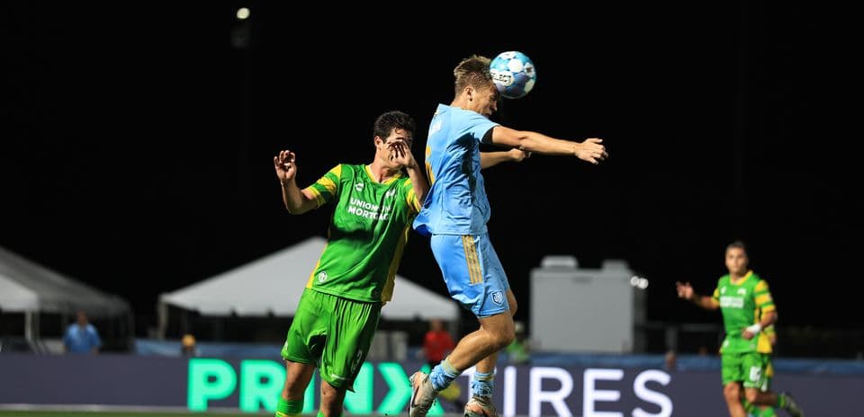 Players competing for the ball during match