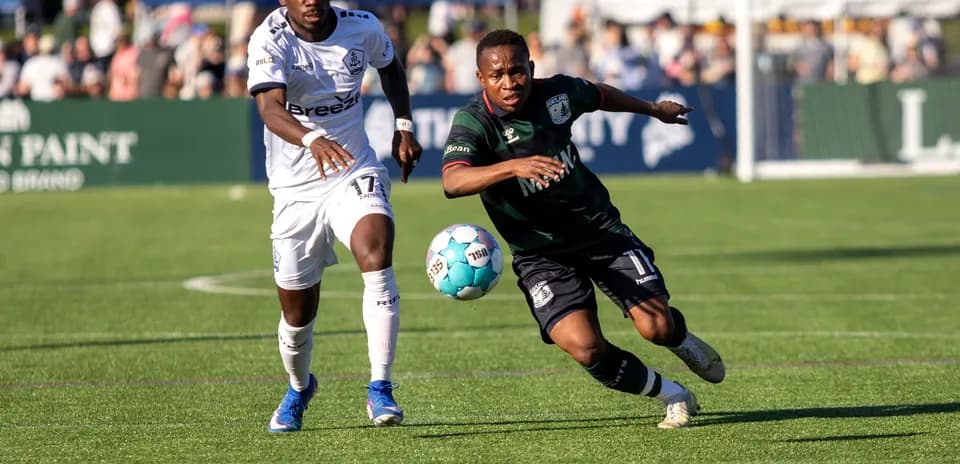 Players competing for the ball during match