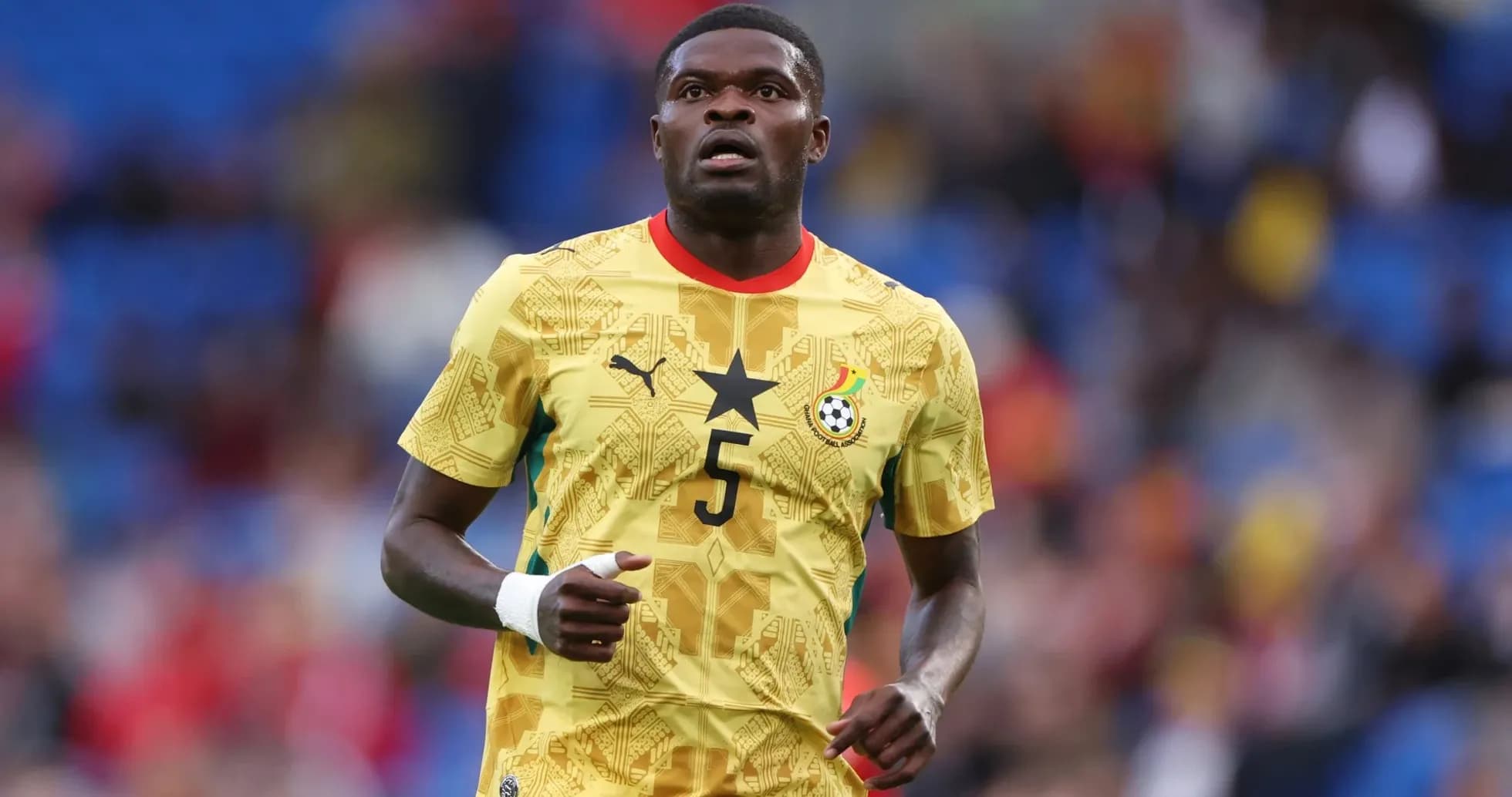 Ghanaian player wearing yellow jersey on the field