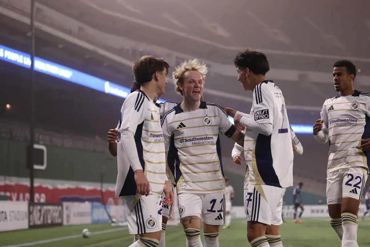 Players celebrating a goal during match