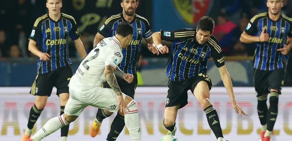 Players competing for the ball during match