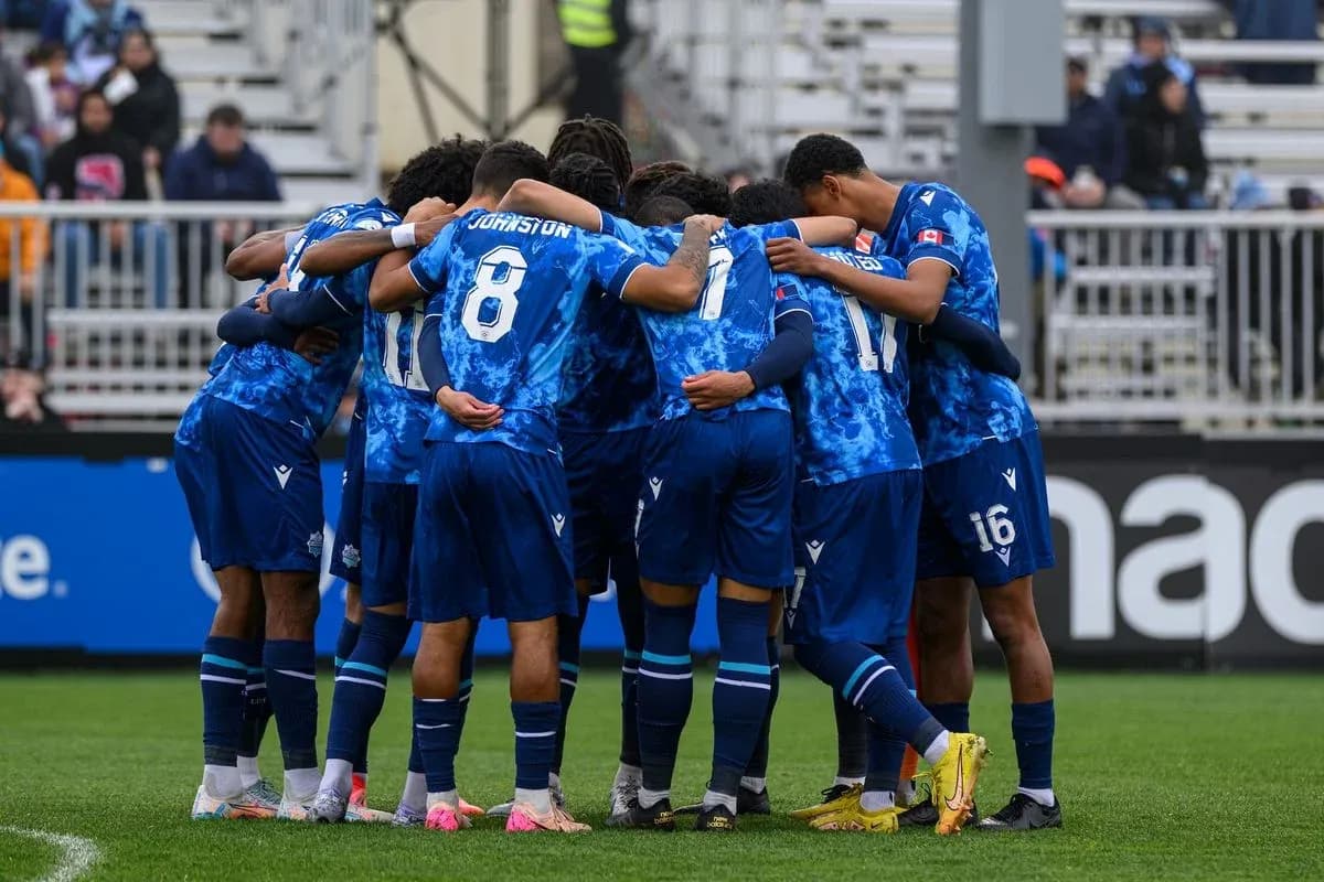 Cavalry FC players huddled before match