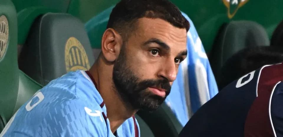 Player sitting on bench during a match