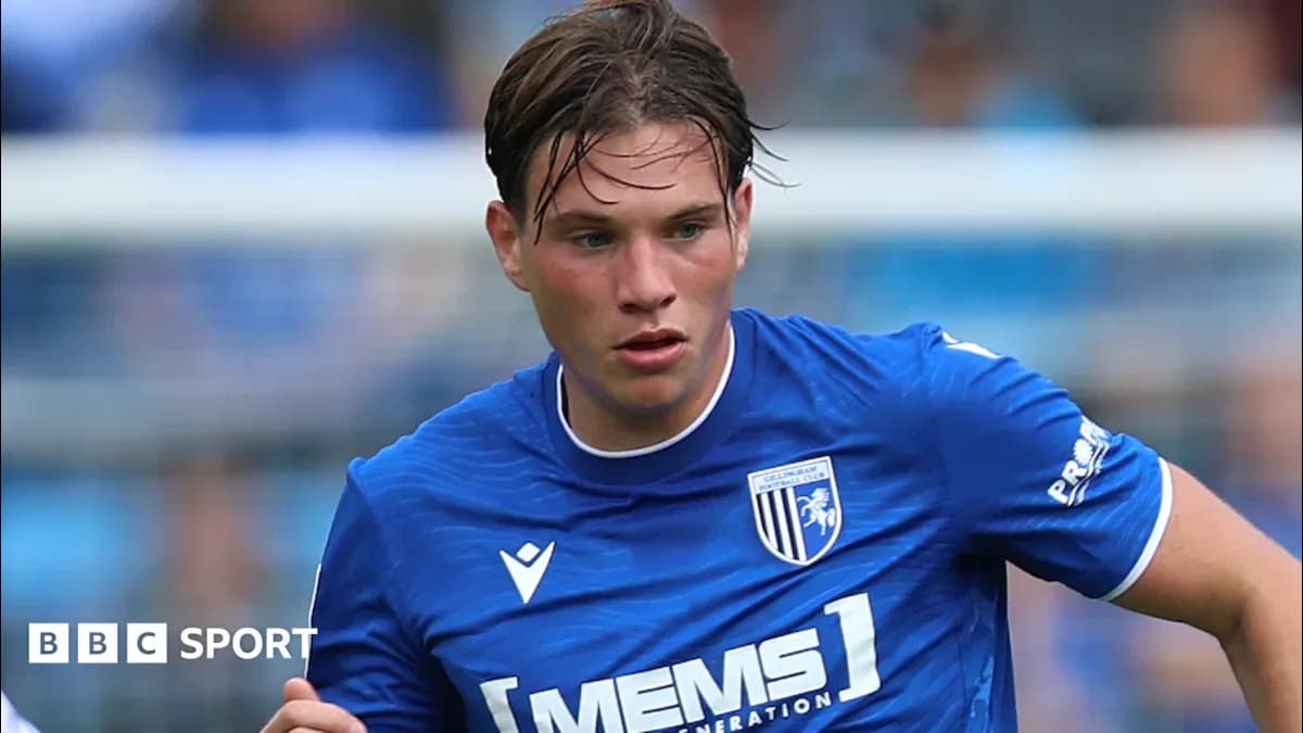 Player in blue kit running during a match