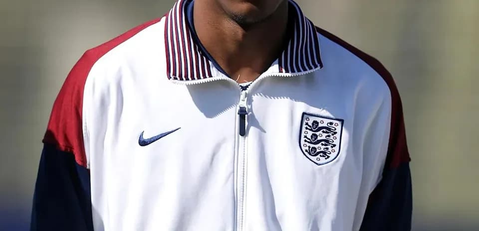 Player wearing England training jacket outdoors