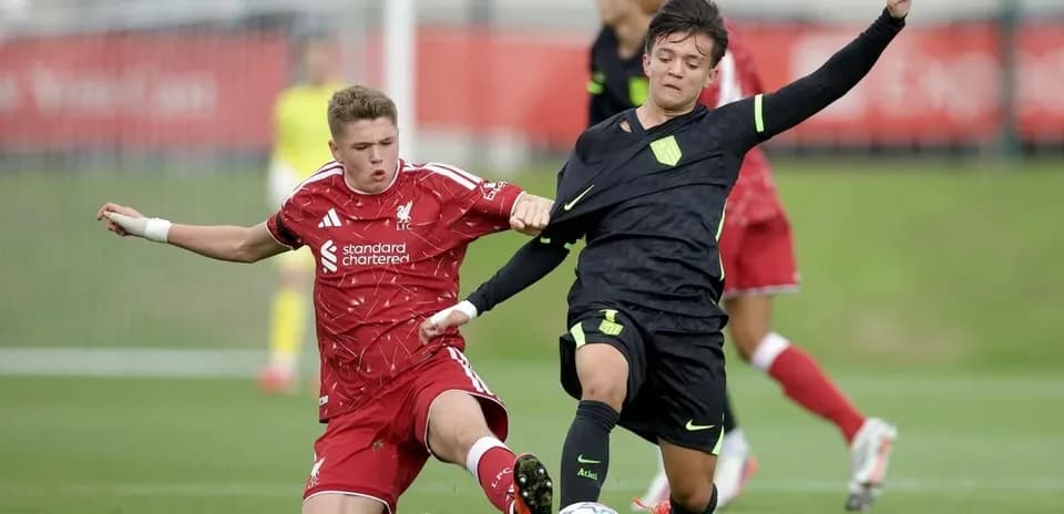 Two players competing for the ball during match