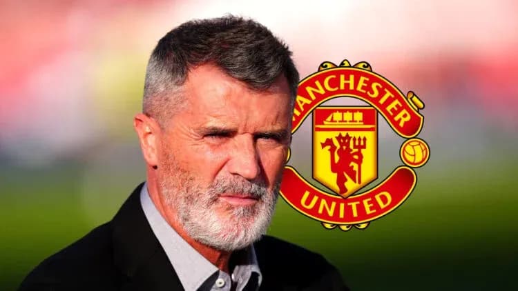 Man with gray beard near Manchester United logo