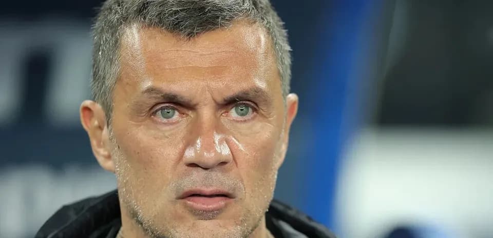 Coach focused during a match on the sidelines