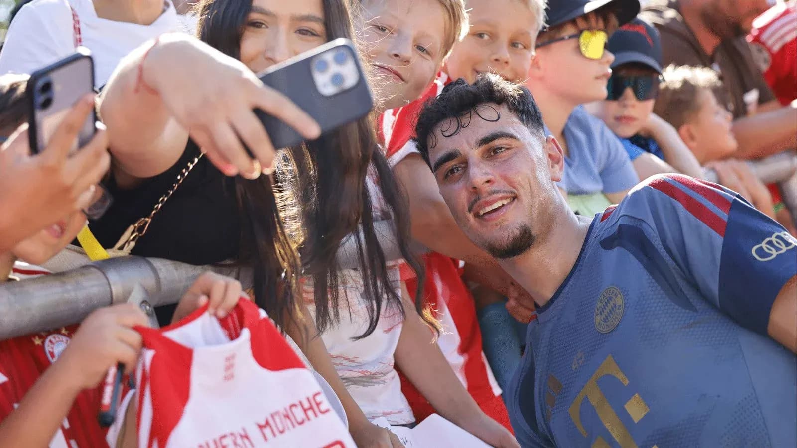 Player taking selfie with fans after match