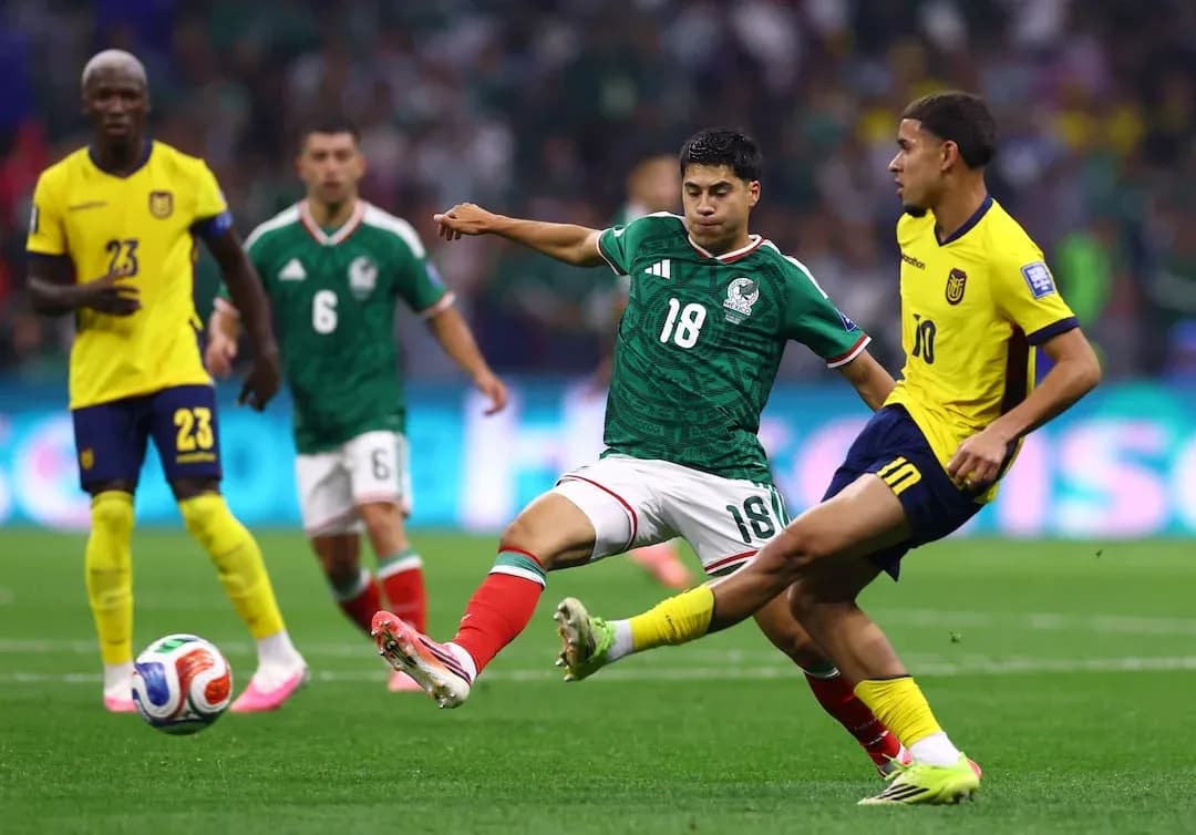 Mexico player tackles Ecuador opponent in match
