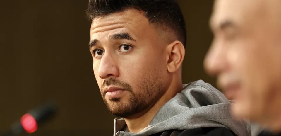 Player at press conference with microphone in view