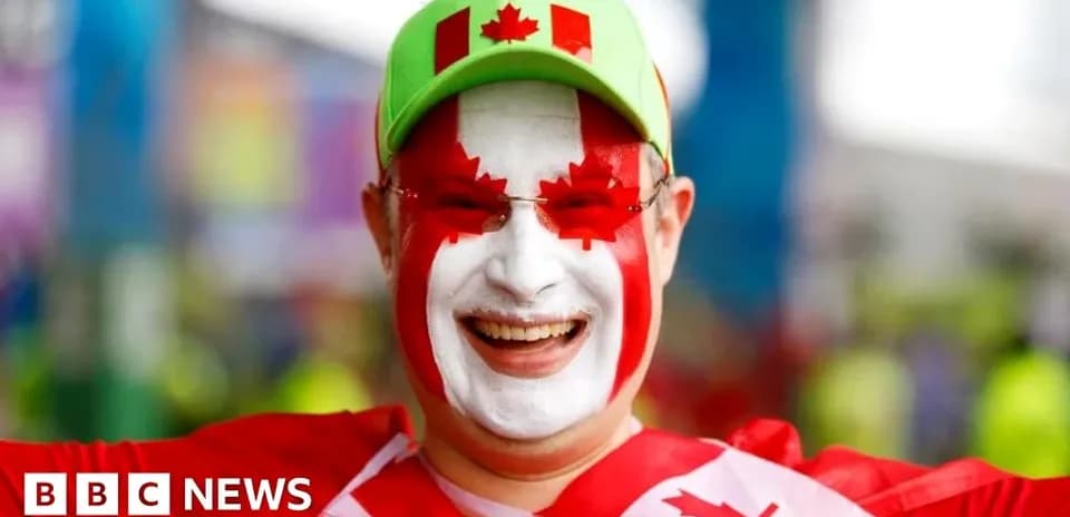 Fan with painted face celebrating Canadian pride