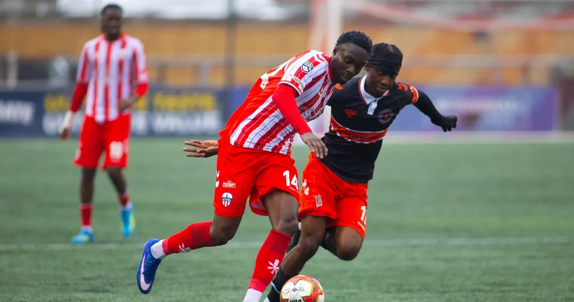 Players contesting for the ball in match