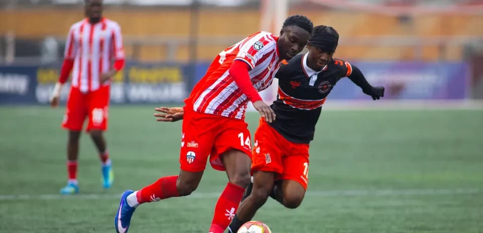 Players contesting for the ball in match