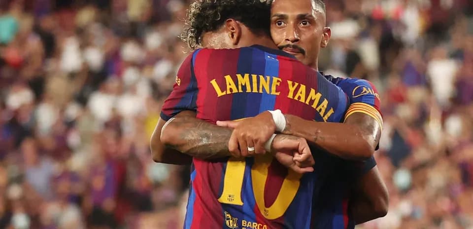 Barcelona players embracing after a goal celebration
