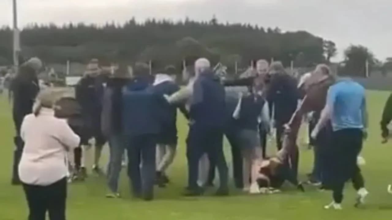 Crowd surrounding a player on the ground