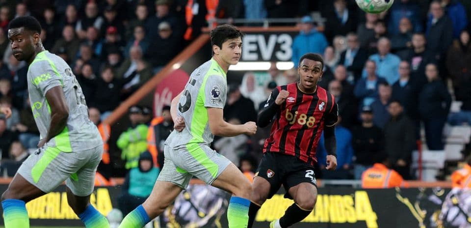 Bournemouth player controlling ball against Manchester City