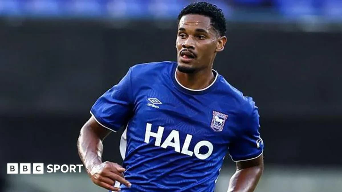 Player in blue jersey running on the pitch