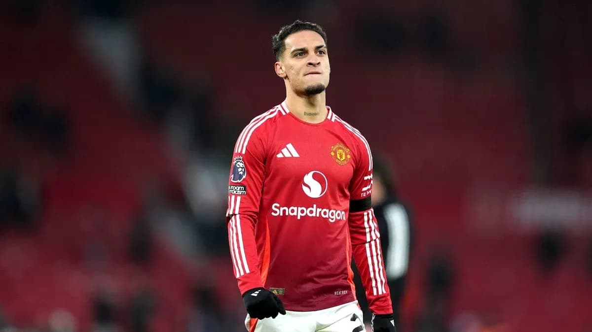 Player celebrating in Manchester United jersey on pitch
