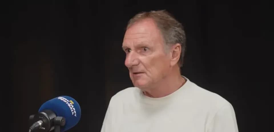 Person speaking into microphone during interview