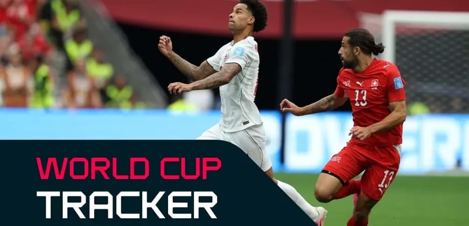 Two players competing for the ball during World Cup match