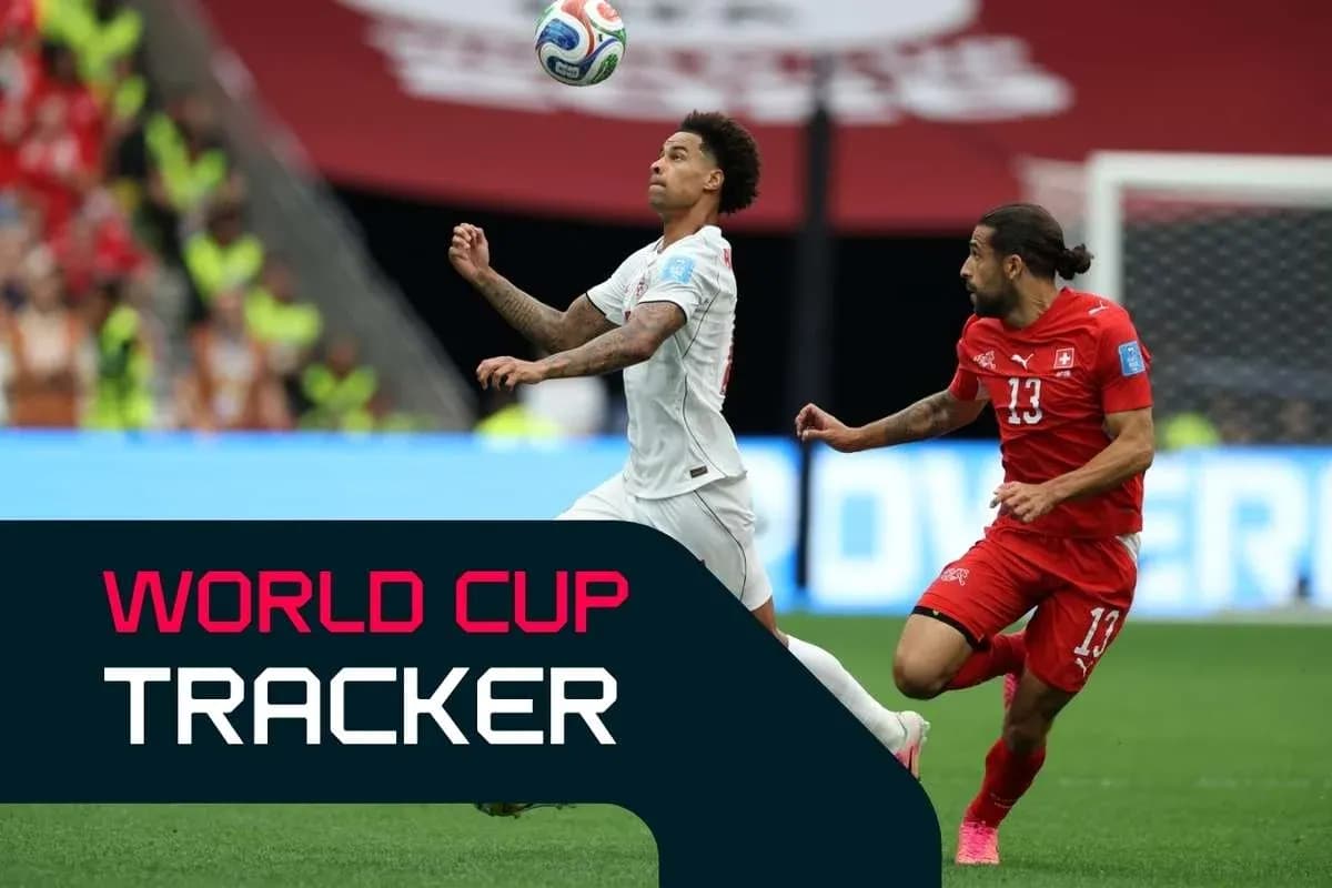 Two players competing for the ball during World Cup match