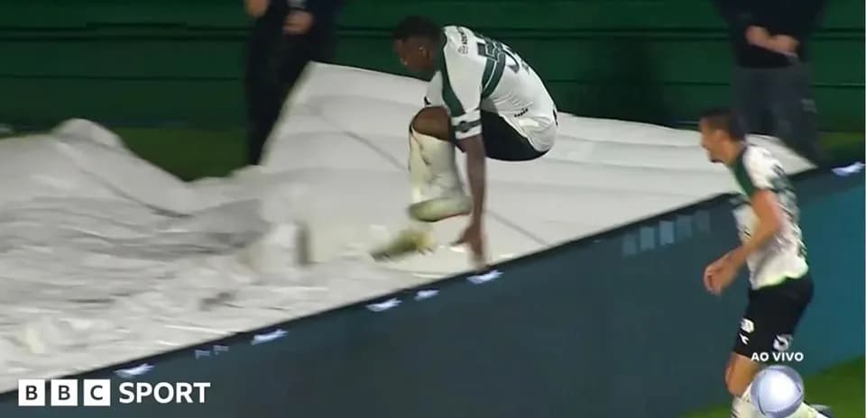 Player jumping over a tarp during the match
