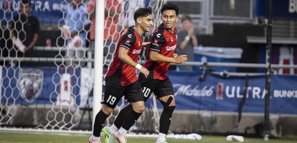 Players celebrating a goal during match