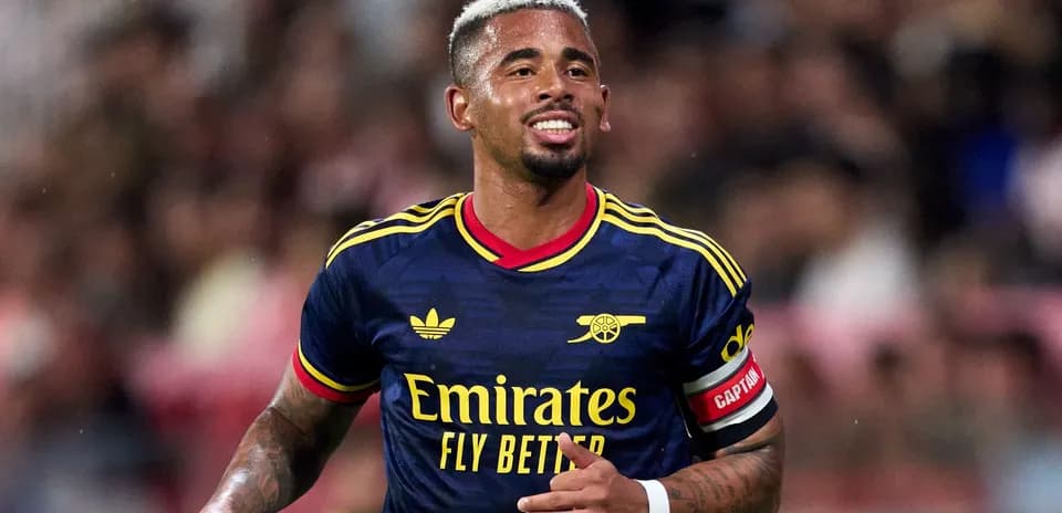 Player celebrating in Arsenal jersey during match