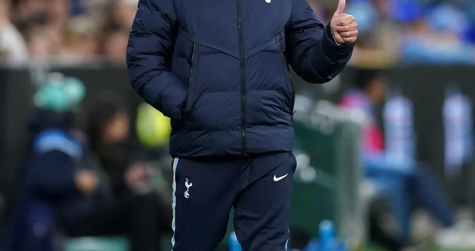 Manager gesturing during match on the sideline