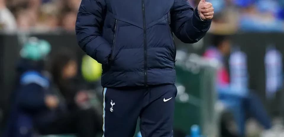 Manager gesturing during match on the sideline