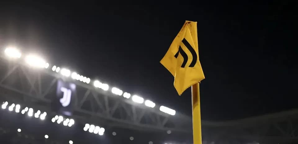 Corner flag with Juventus logo at night stadium