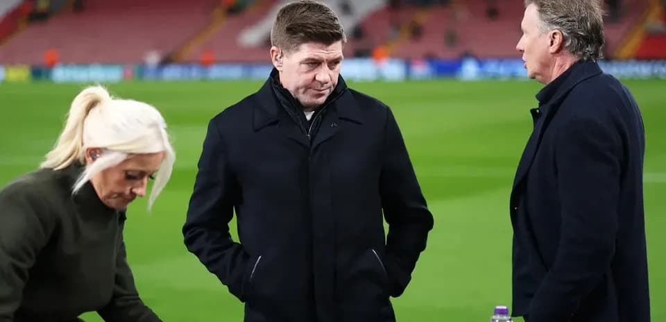 Three sports commentators discussing on the pitch