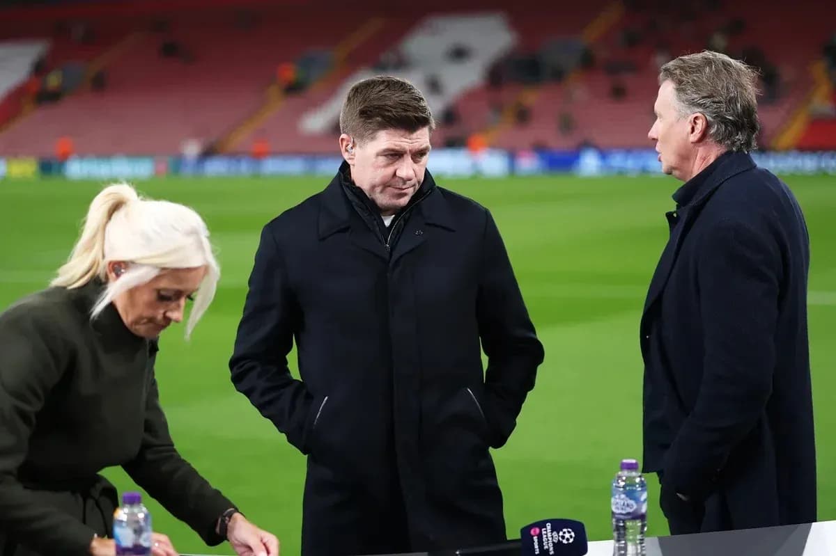 Three sports commentators discussing on the pitch