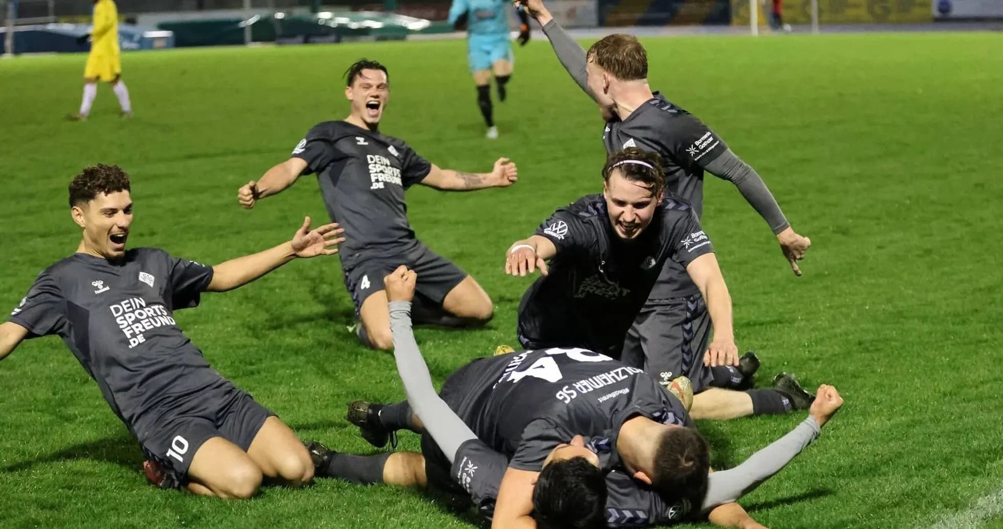 Players celebrating a goal during football match