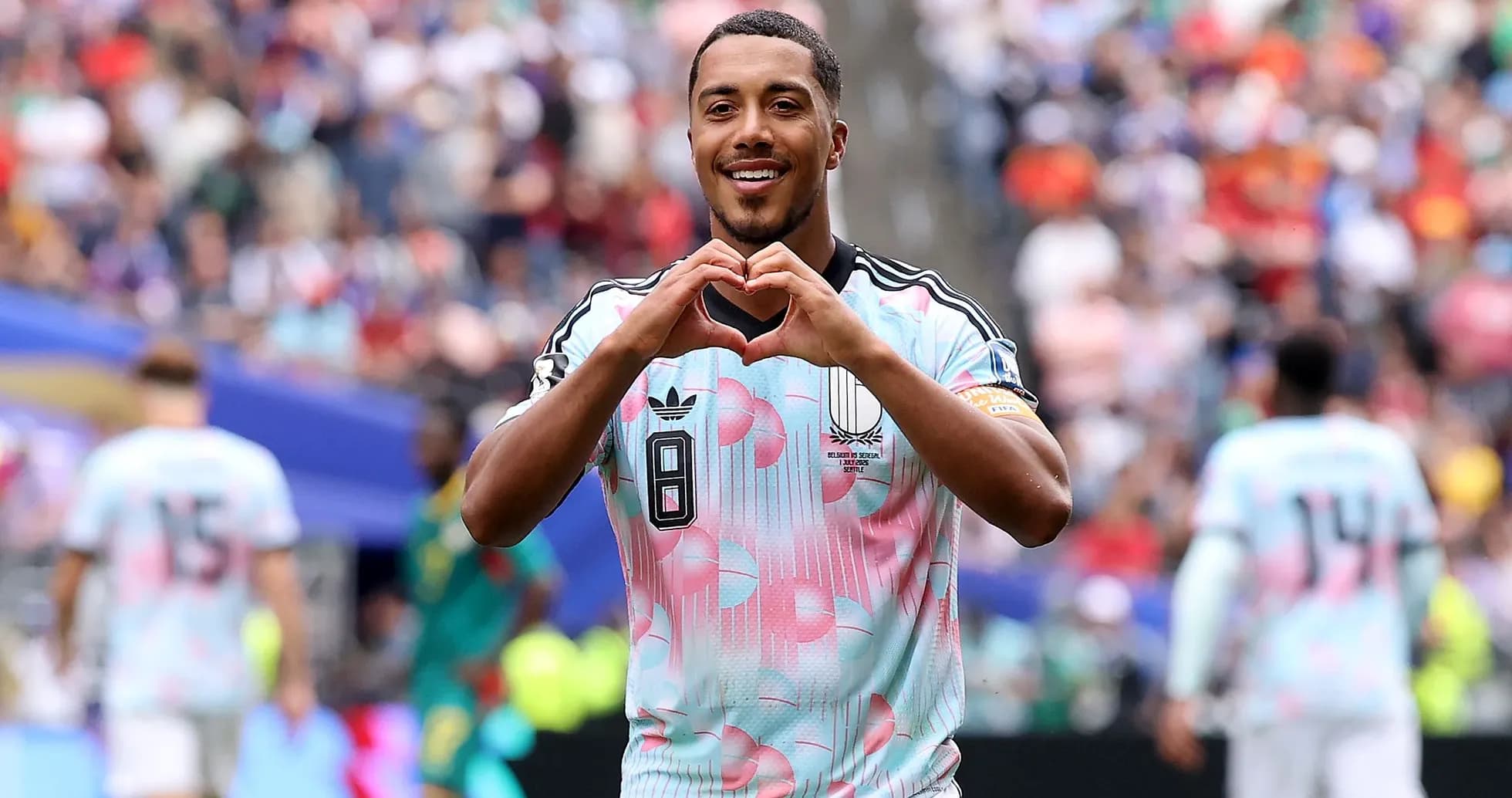 Player celebrating with heart gesture on field