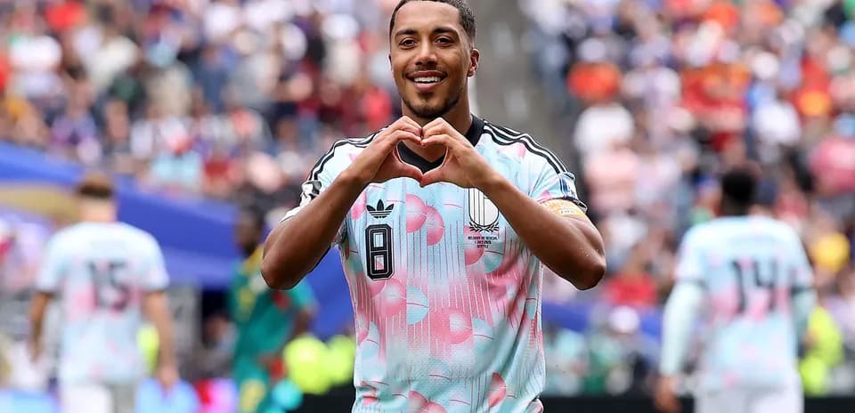 Player celebrating with heart gesture on field