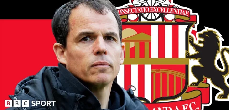 Coach in front of Sunderland AFC club logo