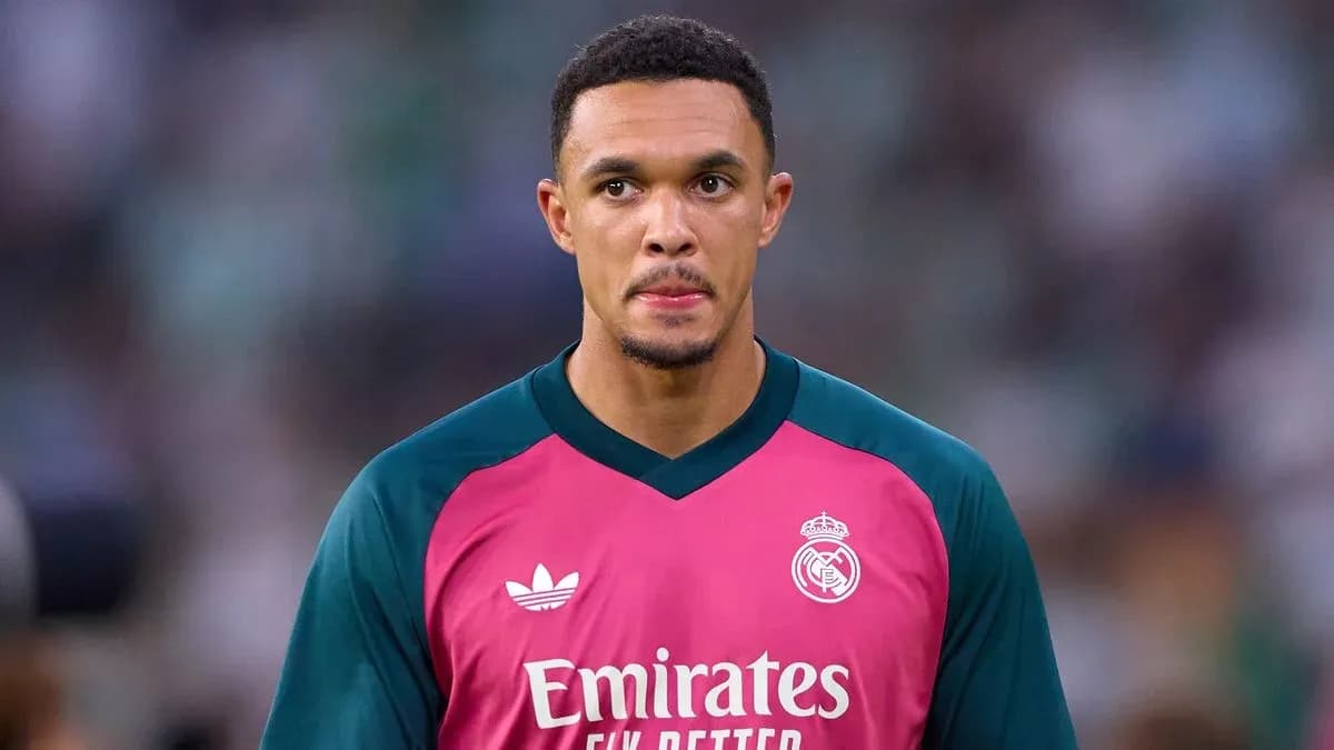 Goalkeeper in pink jersey during match warm-up