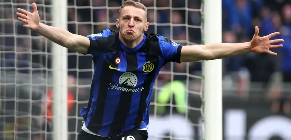 Player celebrating a goal in front of the net
