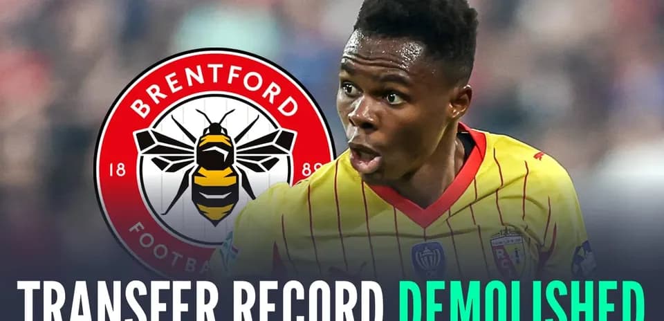 Player celebrating with Brentford logo in background