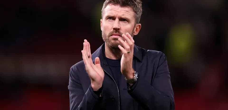 Manager applauding fans after the match