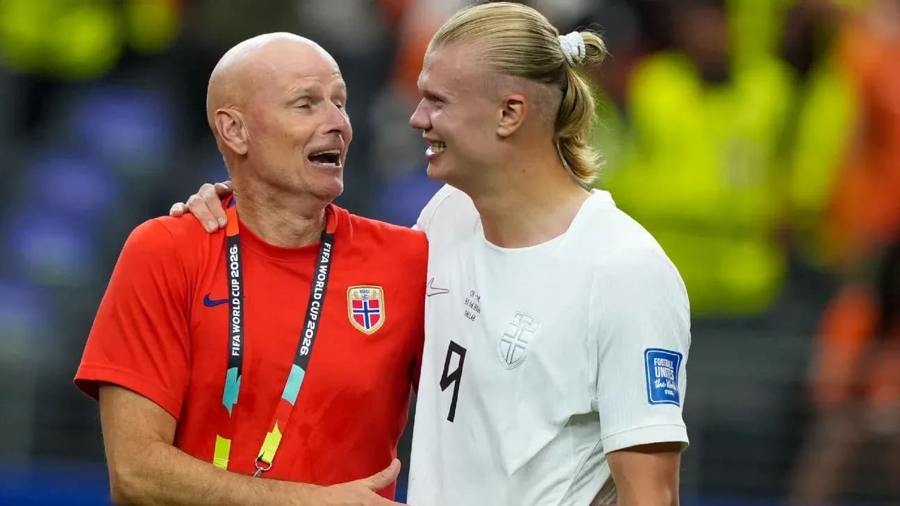Coach and player celebrating after a match