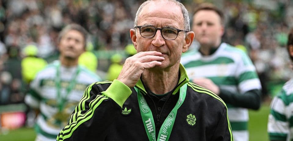 Manager with glasses observing crowd at stadium
